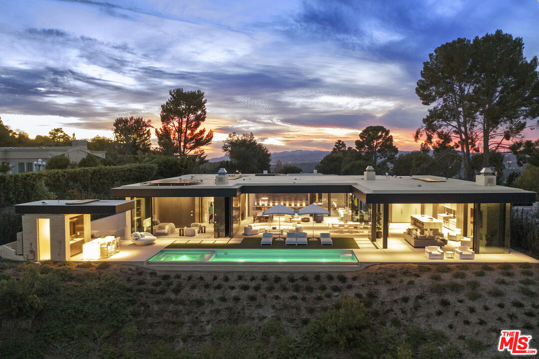 445 Walker Drive Beverly Hills, CA 90210 - Photo 4 of 30 a front view of a house with garden