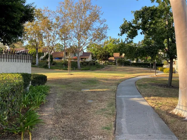 a view of a swimming pool with an outdoor space and seating area