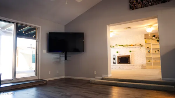a view of a livingroom with furniture and a fireplace
