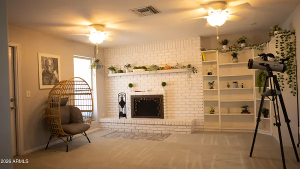 a view of a livingroom with furniture and a fireplace