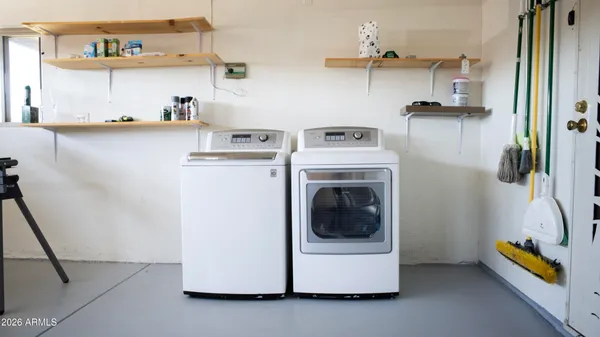 a view of a kitchen with wooden floor and windows