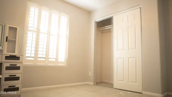 a white toilet sitting next to a shower curtain
