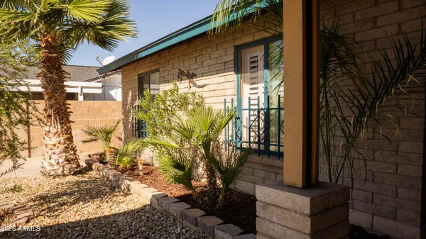 a view of potted plants in front of door