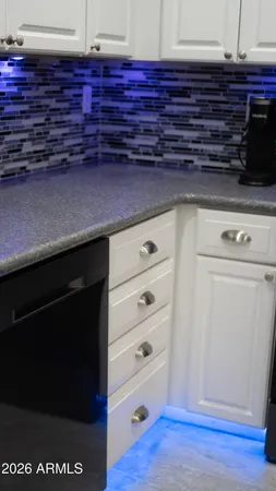 a view of a kitchen with stainless steel appliances granite countertop a refrigerator and a sink