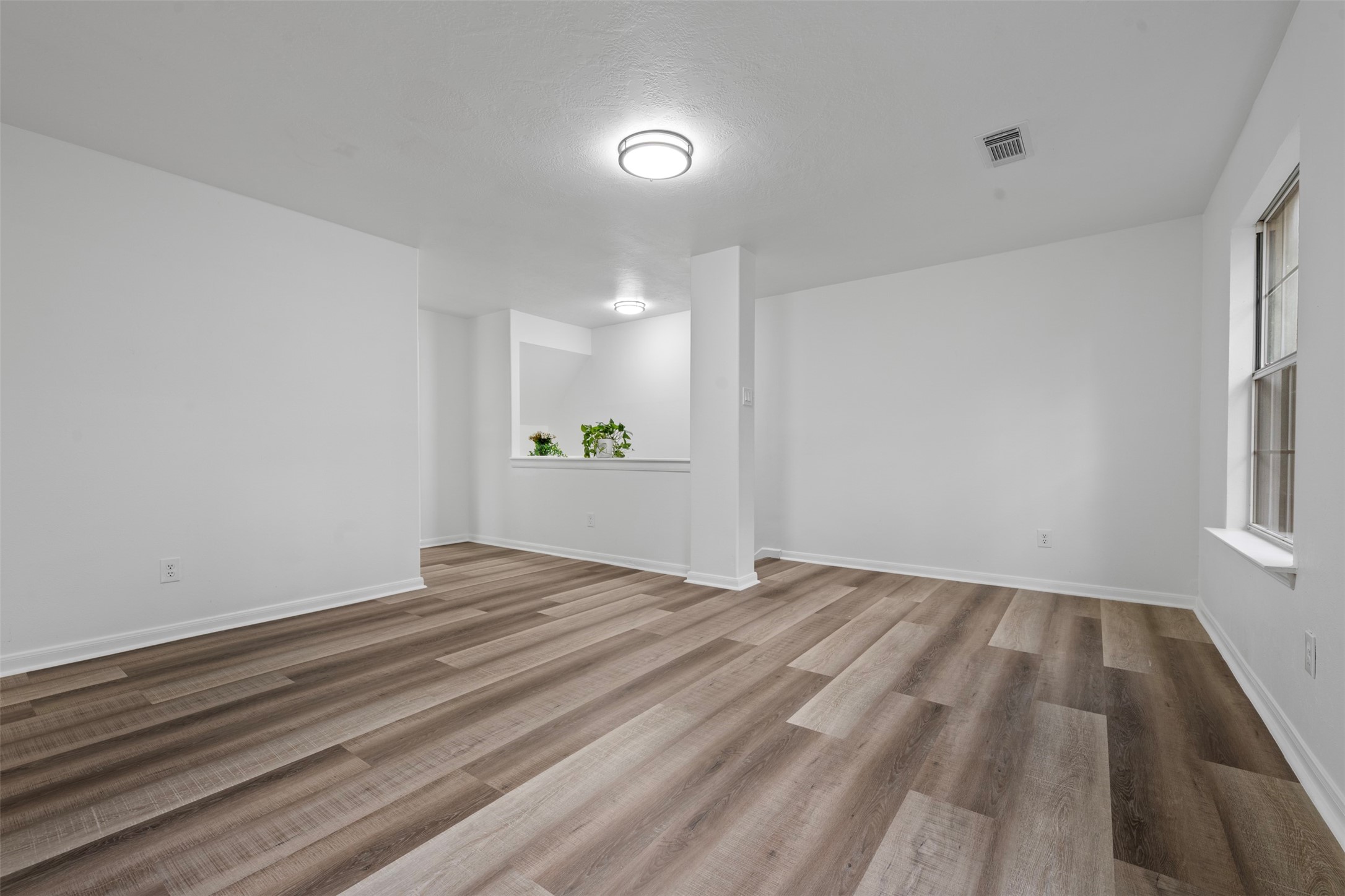 55 Terraglen Drive Spring, TX 77382 - Photo 16 of 33 a view of an empty room with wooden floor and a window