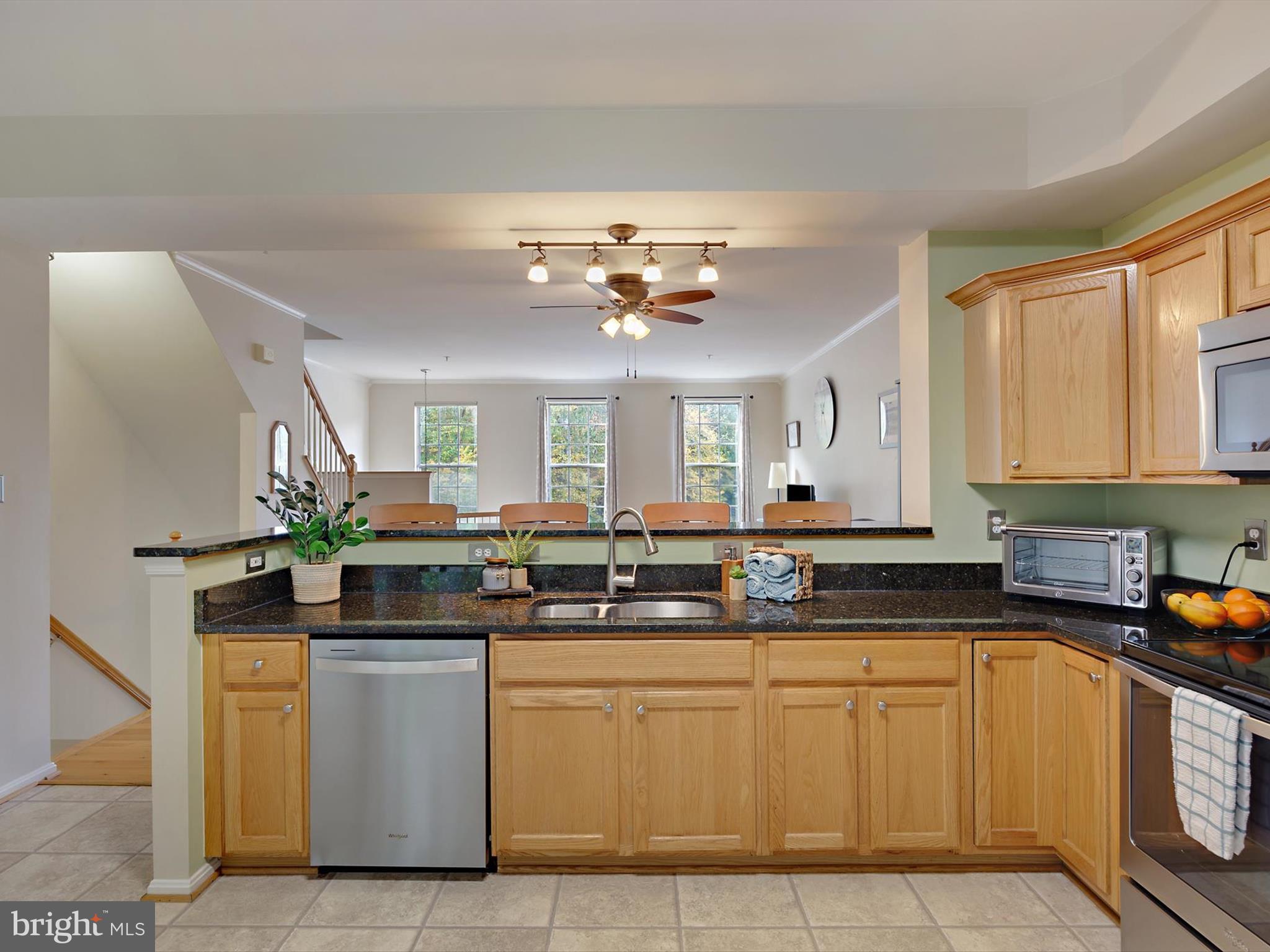 2355 Sandy Walk Way Odenton, MD 21113 - Photo 13 of 68 a kitchen with stainless steel appliances granite countertop a sink and cabinets