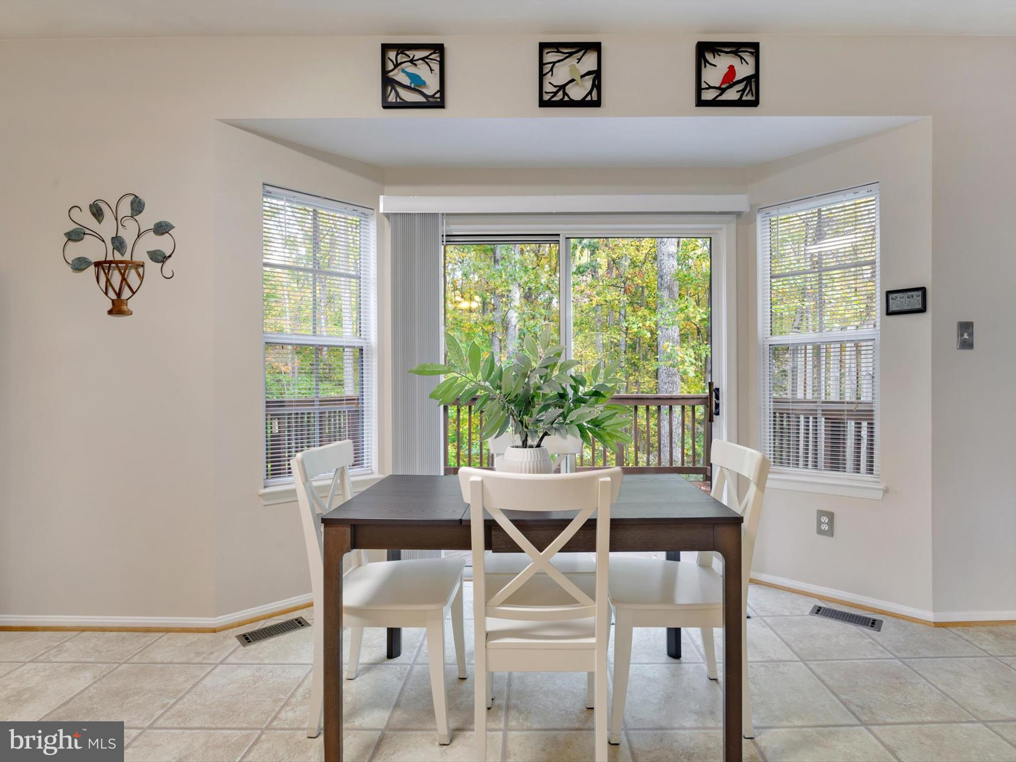 2355 Sandy Walk Way Odenton, MD 21113 - Photo 15 of 68 a view of a dining room with furniture window and outside view