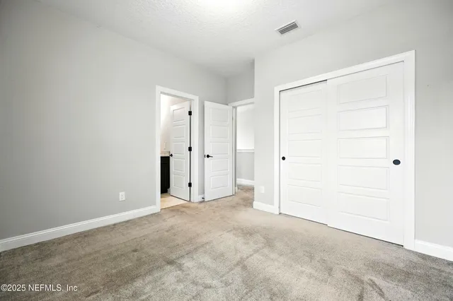 a bathroom with a double vanity sink toilet and shower