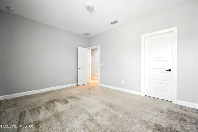 a kitchen with stainless steel appliances kitchen island granite countertop a stove a sink a refrigerator and cabinets