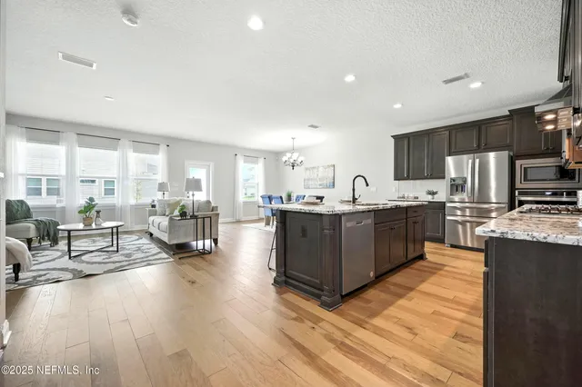 a view of an empty room with a ceiling fan