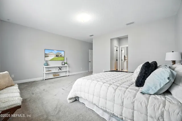 an aerial view of a house with a swimming pool