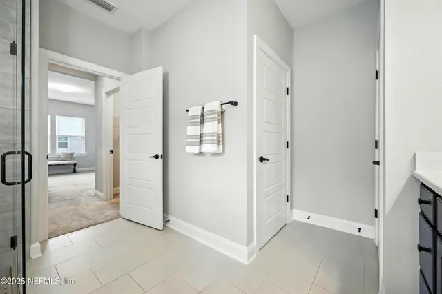 a view of a swimming pool with a lounge chair and palm trees