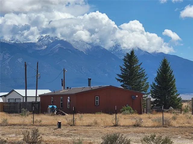 a outdoor view of a house with a yard