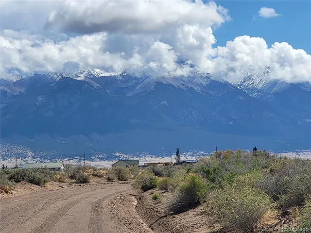 an aerial view of houses covered in trees