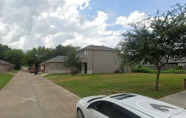 a view of a backyard with sitting area