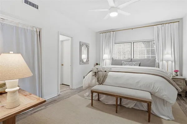 a bedroom with a bed and a table