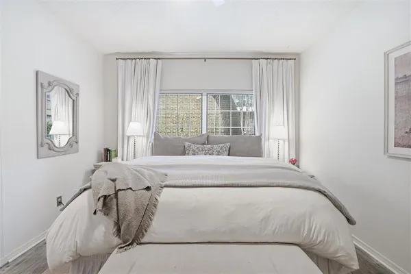 a living room with a bed furniture and a window