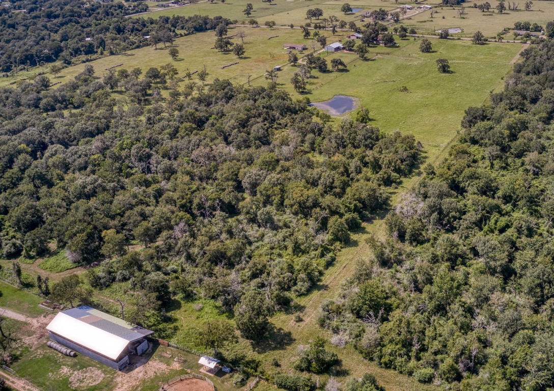 38201 Wiggins Road Hempstead, TX 77445 - Photo 5 of 20 a backyard of a house with a yard and outdoor seating