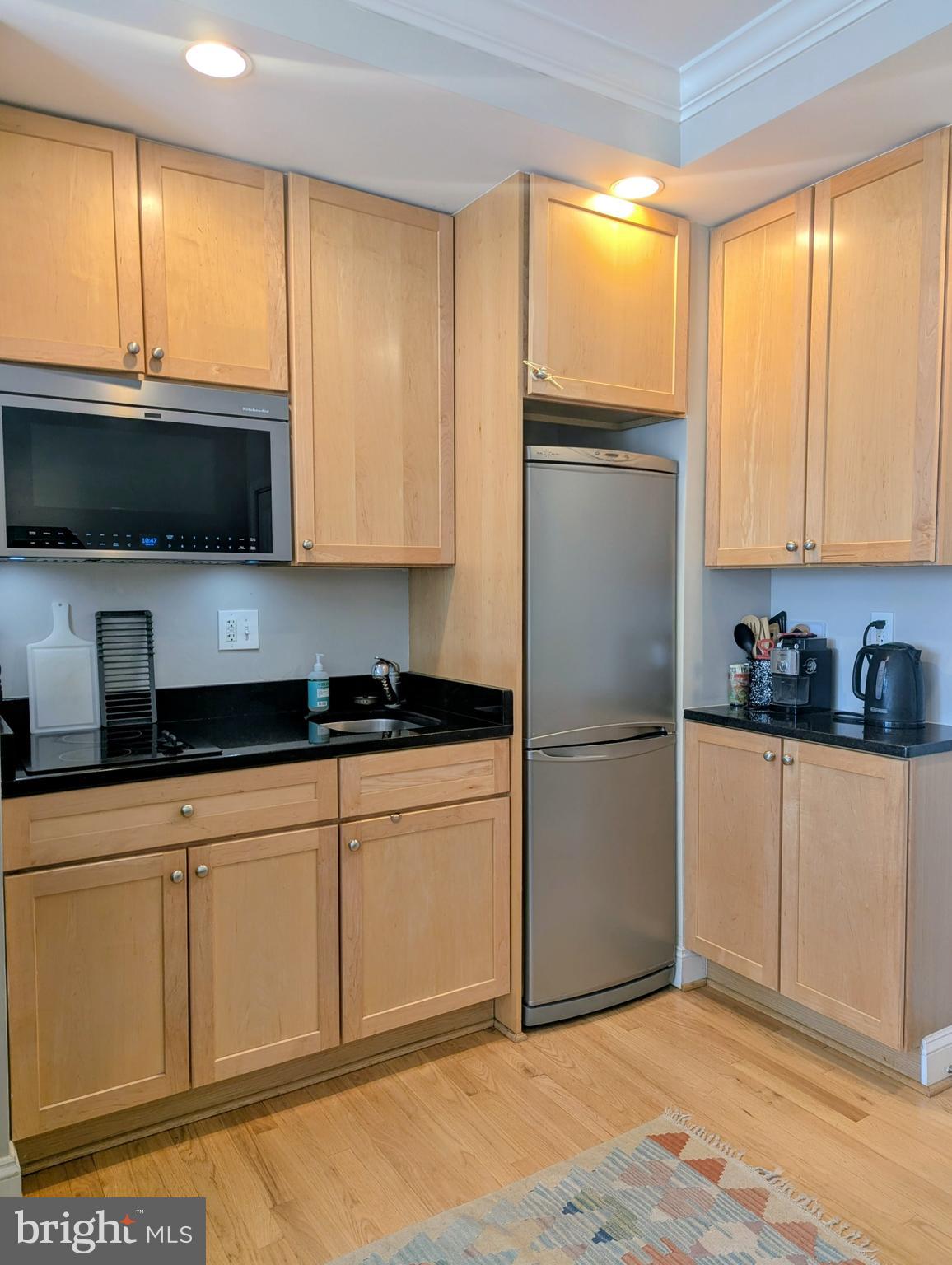 1701 16th Street Northwest, Unit 510 Washington, DC 20009 - Photo 7 of 29 L-shaped kitchen w/abundant cabinet storage