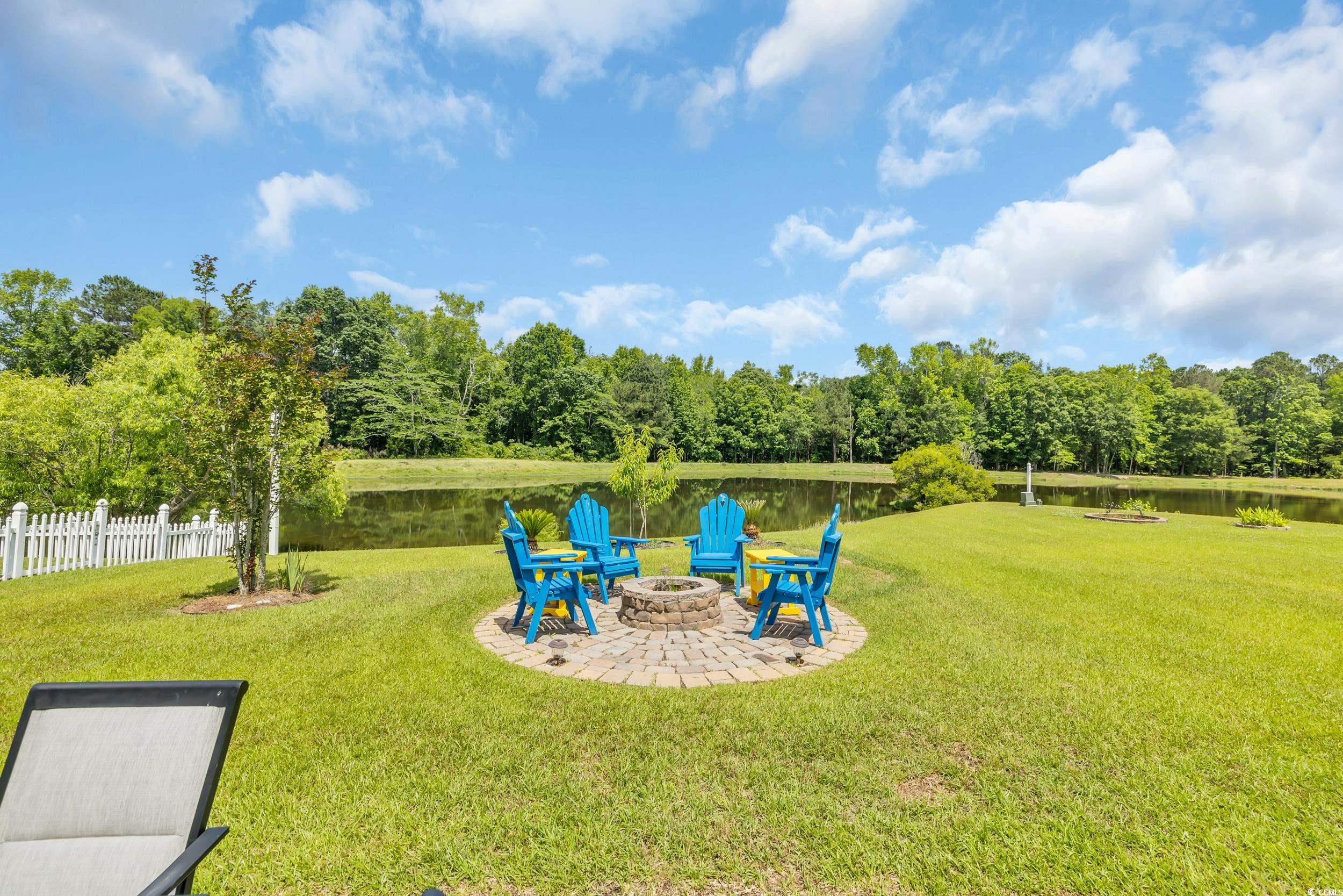 1213 Pine Ridge Street Conway, SC 29527 - Photo 7 of 40 View of yard with a fire pit, a water view, and a patio