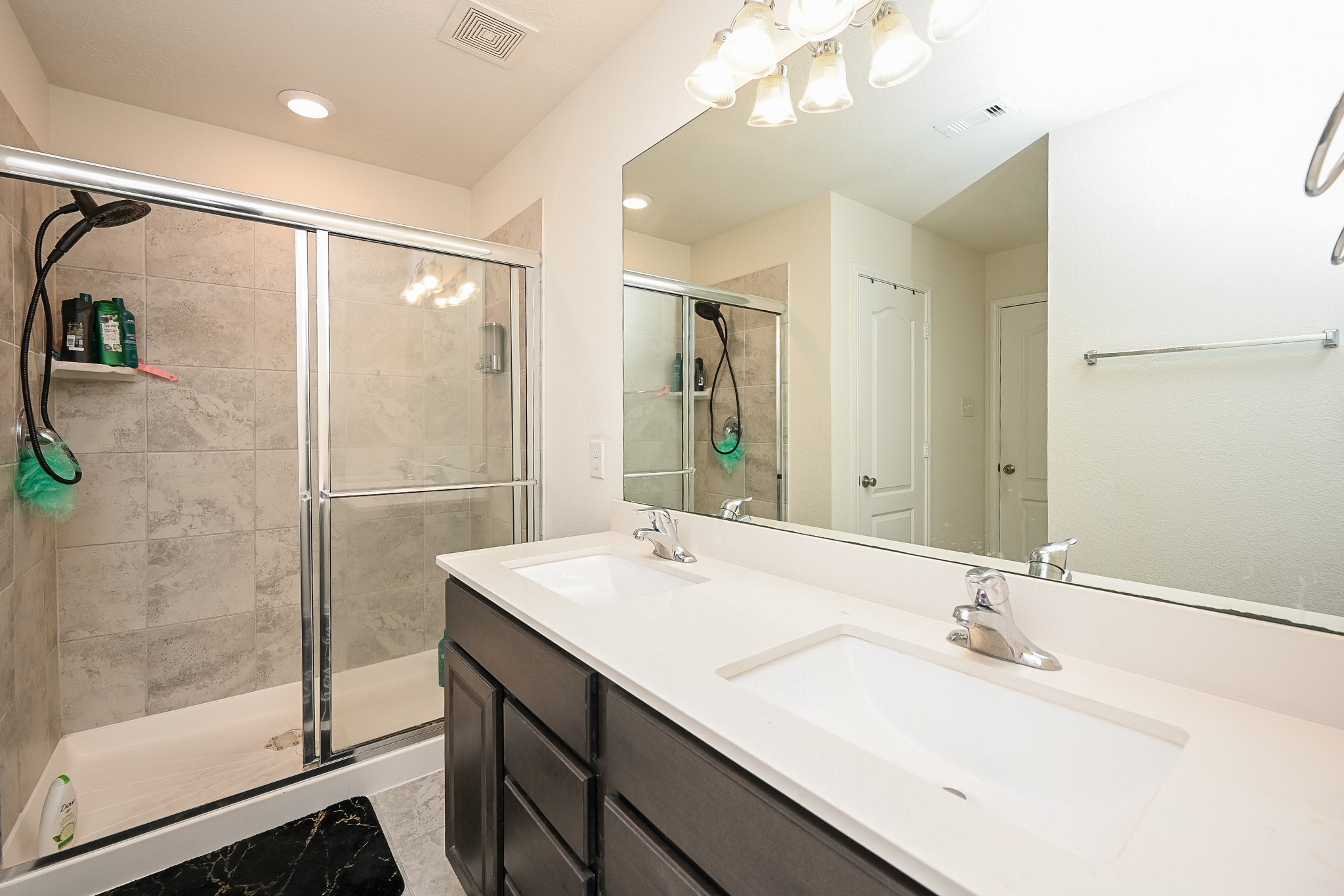 5238 Pine Forest Ridge Street Katy, TX 77493 - Photo 14 of 26 a bathroom with a sink double vanity and shower
