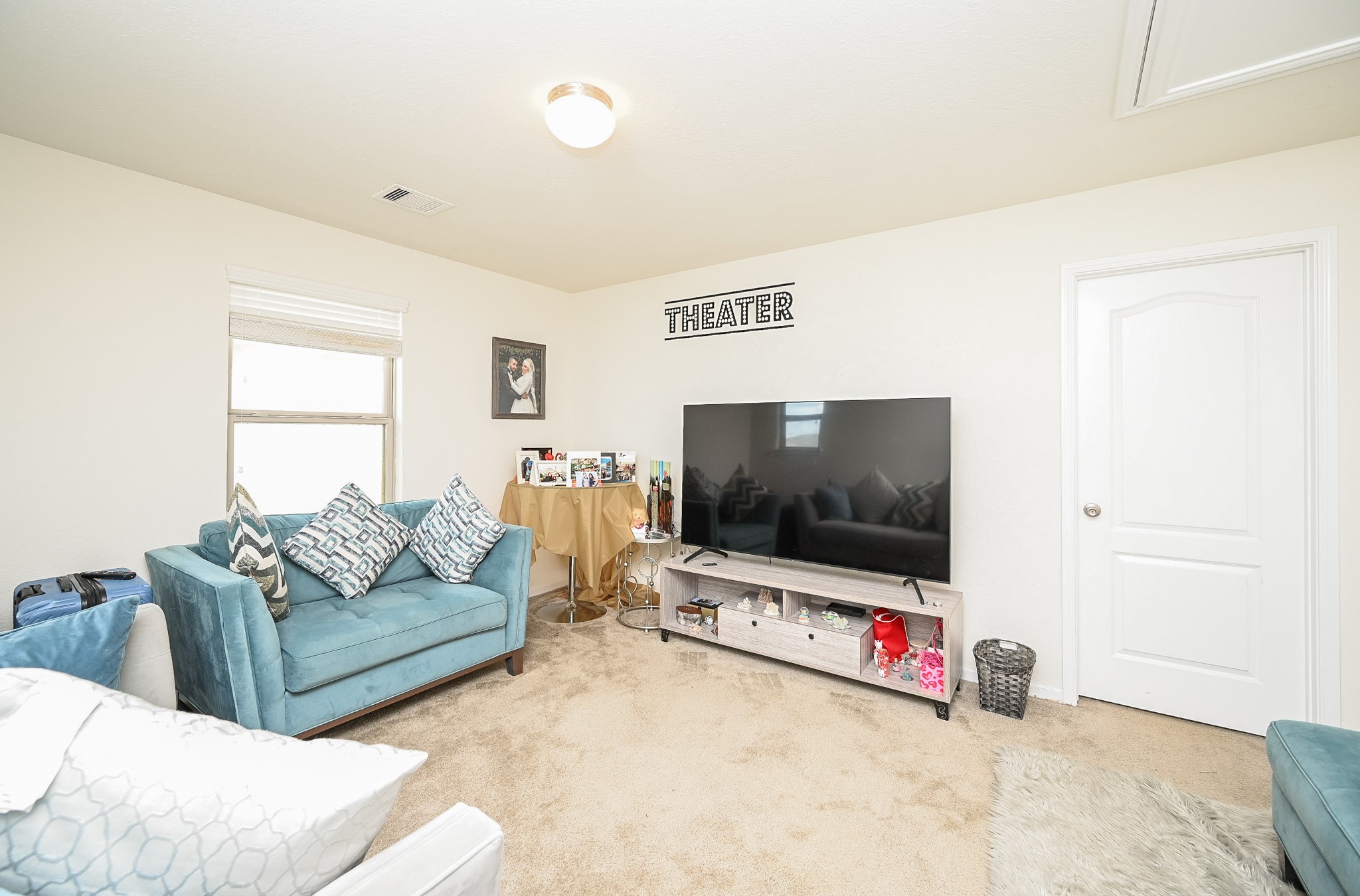 5238 Pine Forest Ridge Street Katy, TX 77493 - Photo 15 of 26 a living room with furniture and a flat screen tv