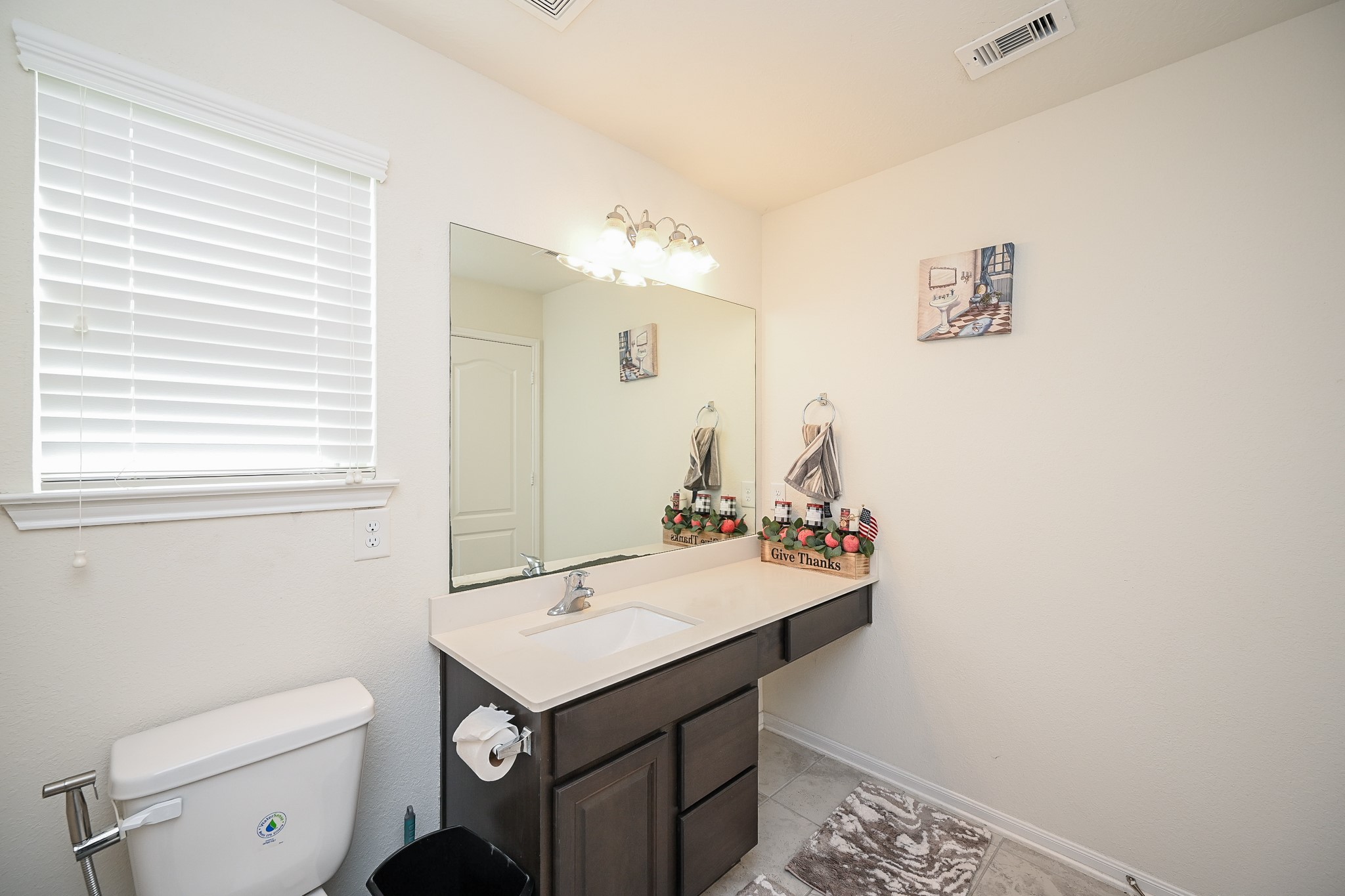 5238 Pine Forest Ridge Street Katy, TX 77493 - Photo 17 of 26 a bathroom with a sink toilet and mirror