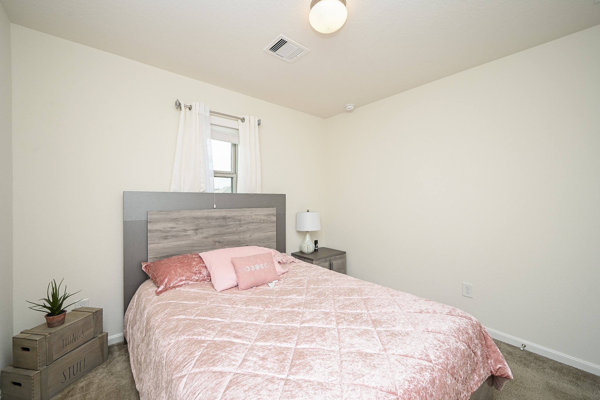 5238 Pine Forest Ridge Street Katy, TX 77493 - Photo 19 of 26 a bedroom with a bed and a potted plant