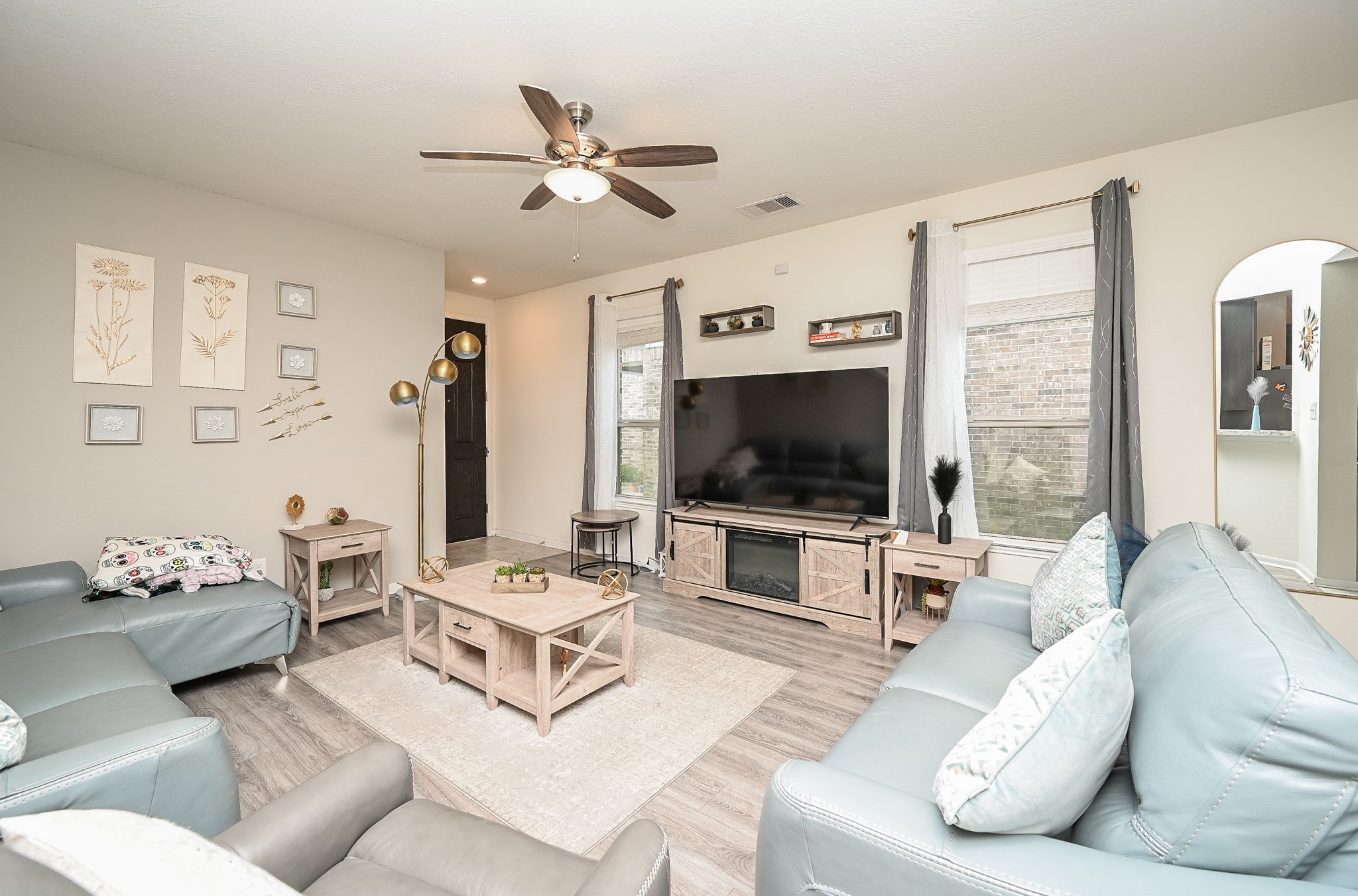 5238 Pine Forest Ridge Street Katy, TX 77493 - Photo 4 of 26 a living room with furniture and a flat screen tv