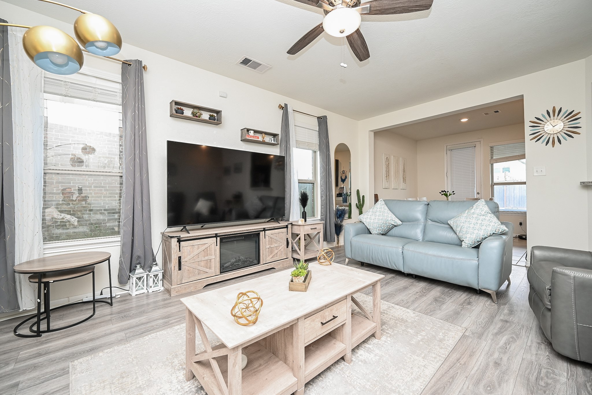 5238 Pine Forest Ridge Street Katy, TX 77493 - Photo 5 of 26 a living room with furniture and a flat screen tv