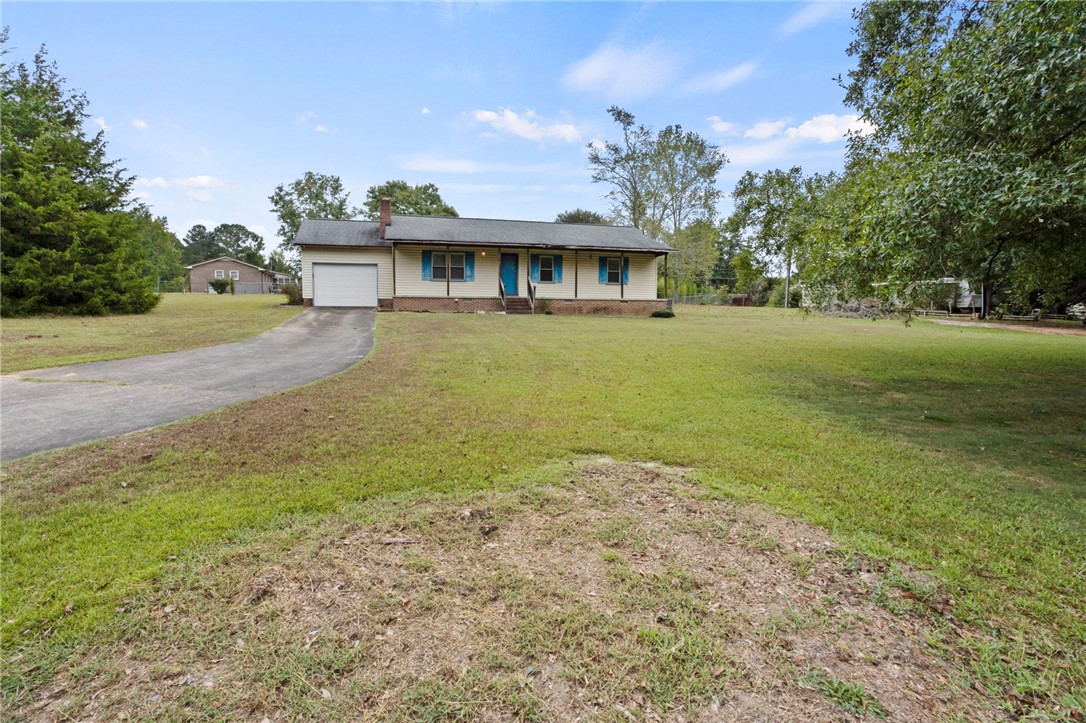 1022 Lakemont Road Starr, SC 29684 - Photo 4 of 24 An asphalt driveway leads to this charming ranch home with a spacious front lawn.