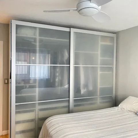 a room with a bed and walk in closet