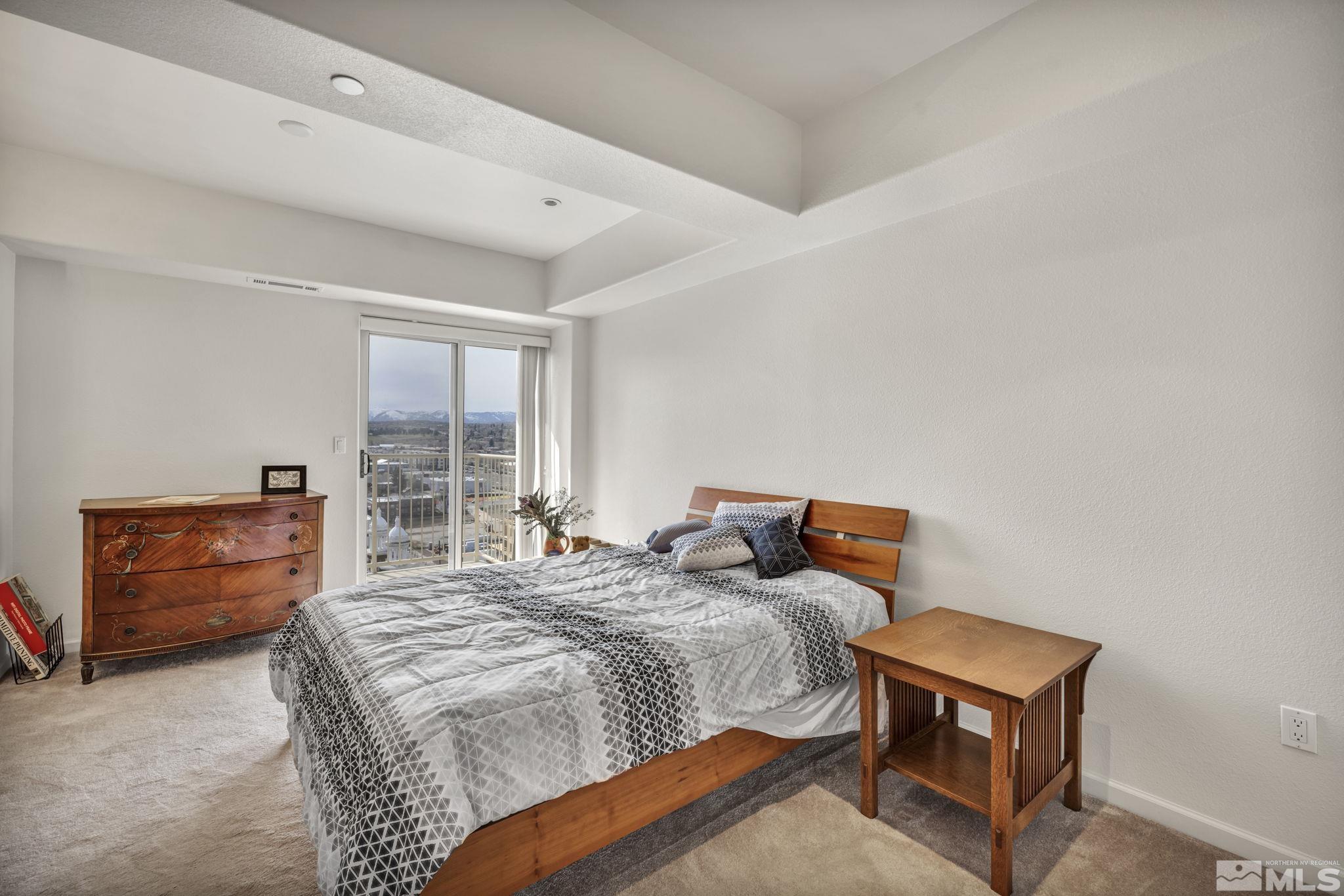 200 West 2nd Street, Unit 1207 Reno, NV 89501 - Photo 11 of 39 a bedroom with a bed and a window