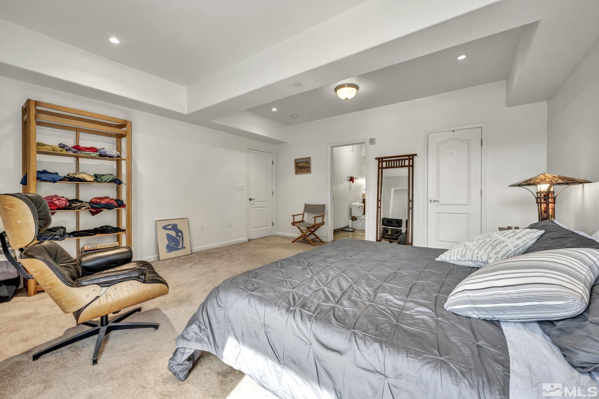 200 West 2nd Street, Unit 1207 Reno, NV 89501 - Photo 18 of 39 a bedroom with a bed and a chair