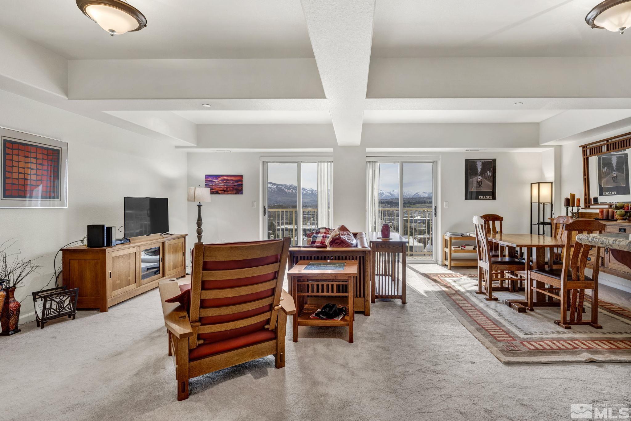 200 West 2nd Street, Unit 1207 Reno, NV 89501 - Photo 24 of 39 a living room with furniture and a flat screen tv