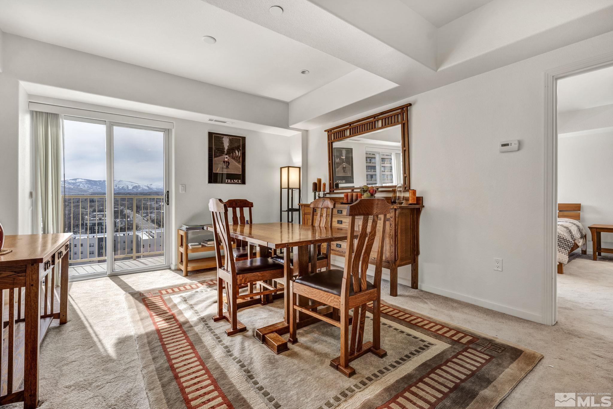 200 West 2nd Street, Unit 1207 Reno, NV 89501 - Photo 25 of 39 a dining room with furniture window and wooden floor