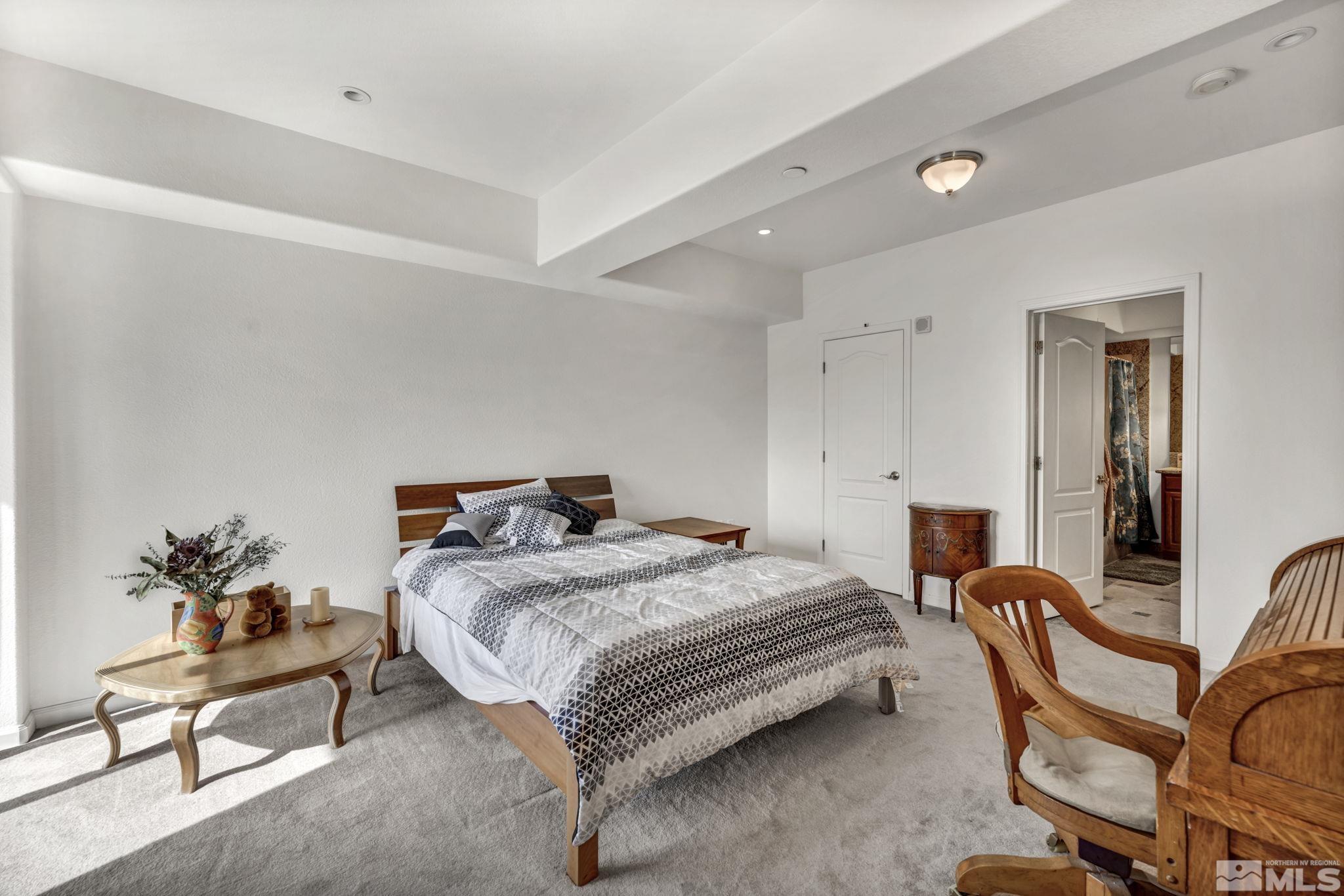 200 West 2nd Street, Unit 1207 Reno, NV 89501 - Photo 9 of 39 a bedroom with a bed and furniture