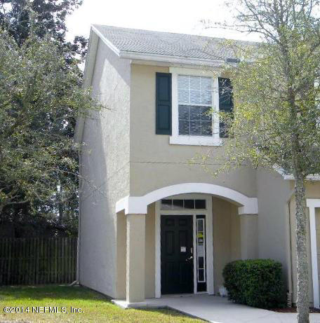 a front view of a house with yard