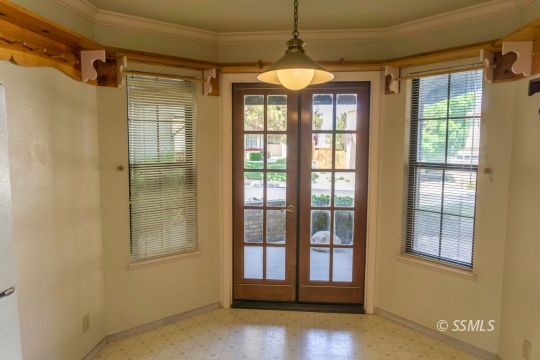 241 West Yellowstone Place Ridgecrest, CA 93555 - Photo 16 of 31 a view of a livingroom with wooden floor and windows