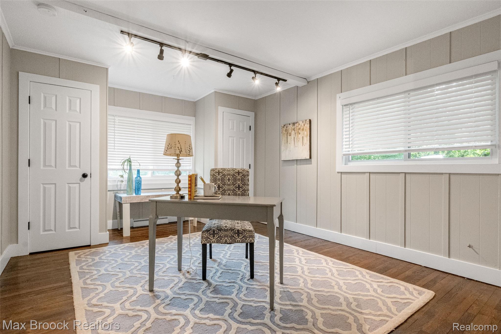 2905 Lahser Road Bloomfield Hills, MI 48304 - Photo 17 of 28 Room featuring warm wood-finish flooring and track lighting