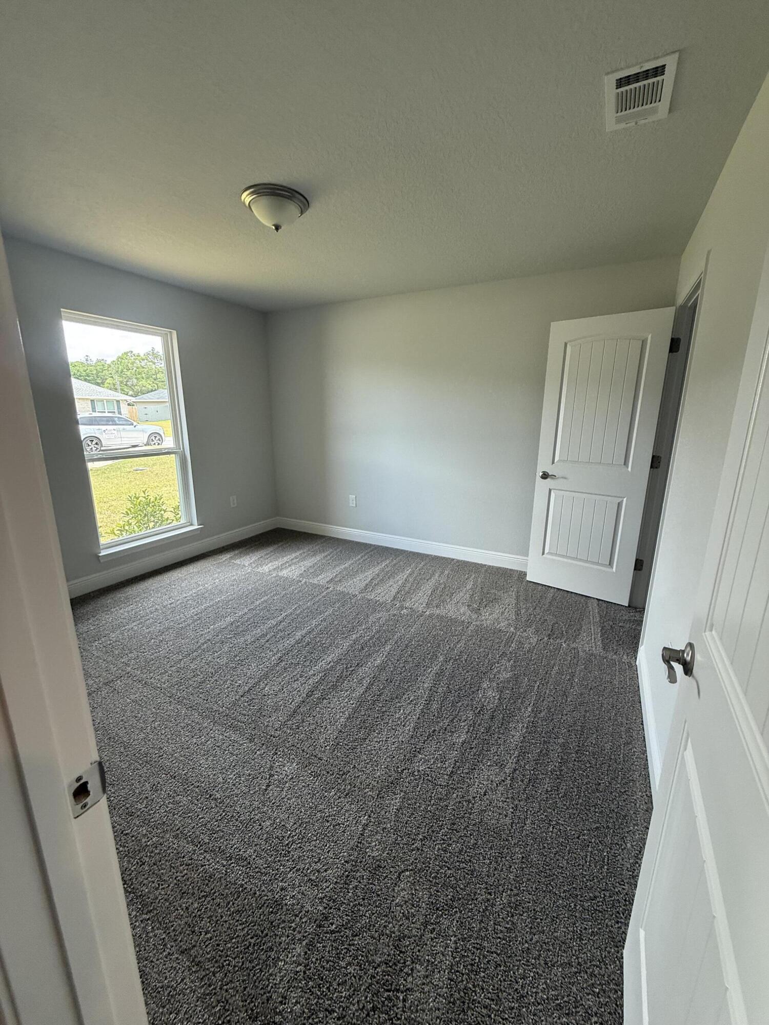 6004 Crocket Cove Crestview, FL 32539 - Photo 13 of 24 a view of an empty room and a window