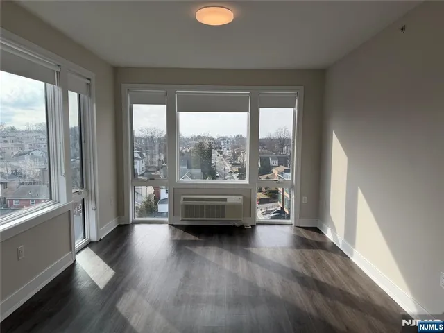 a view of outdoor space with wooden floor and windows