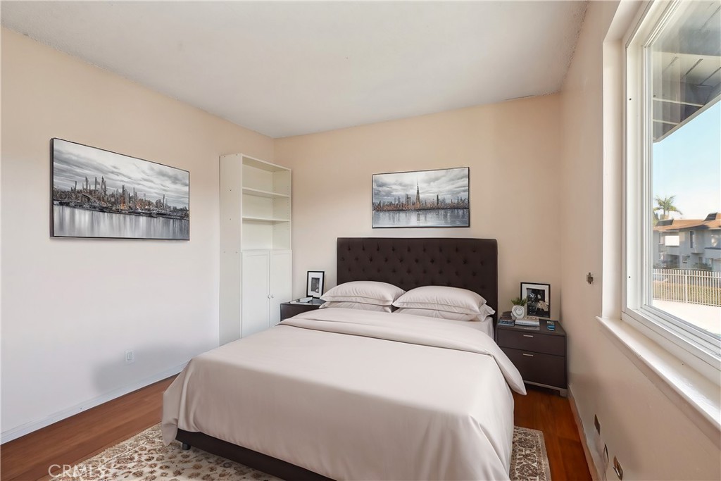 4018 Bryant Court Cypress, CA 90630 - Photo 5 of 16 a bedroom with a bed and a painting on the wall