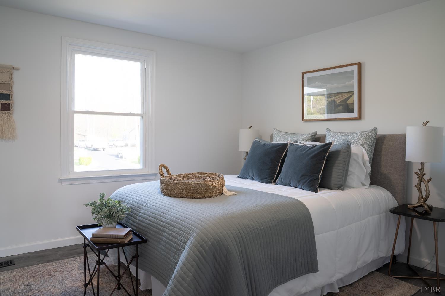 405 Spring Mill Road Concord, VA 24538 - Photo 16 of 28 a bedroom with a bed and a table