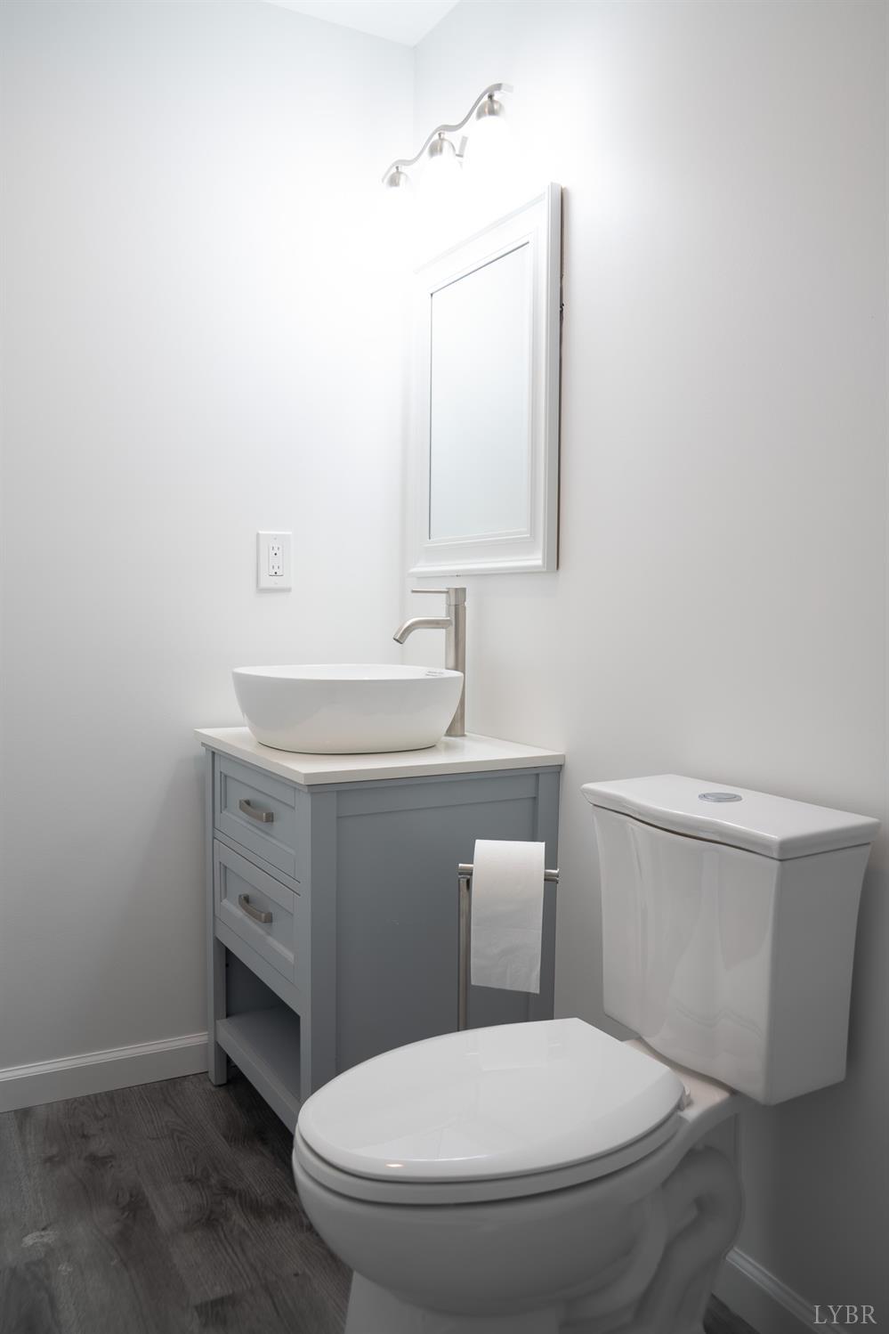 405 Spring Mill Road Concord, VA 24538 - Photo 26 of 28 a white toilet sitting next to a bathroom sink