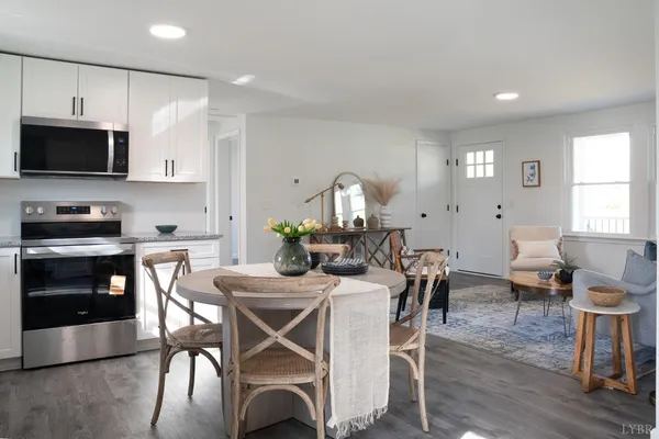 a view of a dining room with furniture and wooden floor
