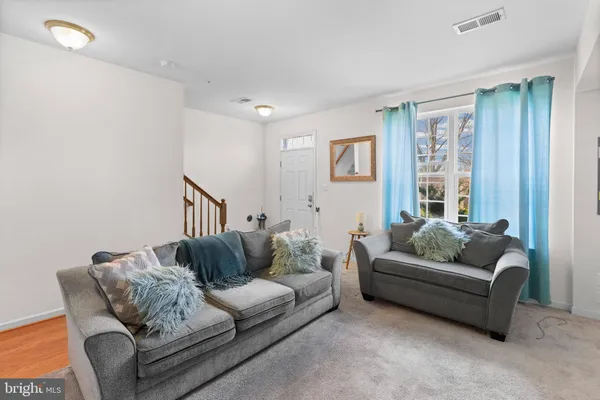 a living room with furniture and a couch