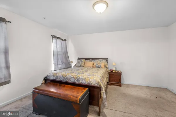 a bedroom with a bed and a table