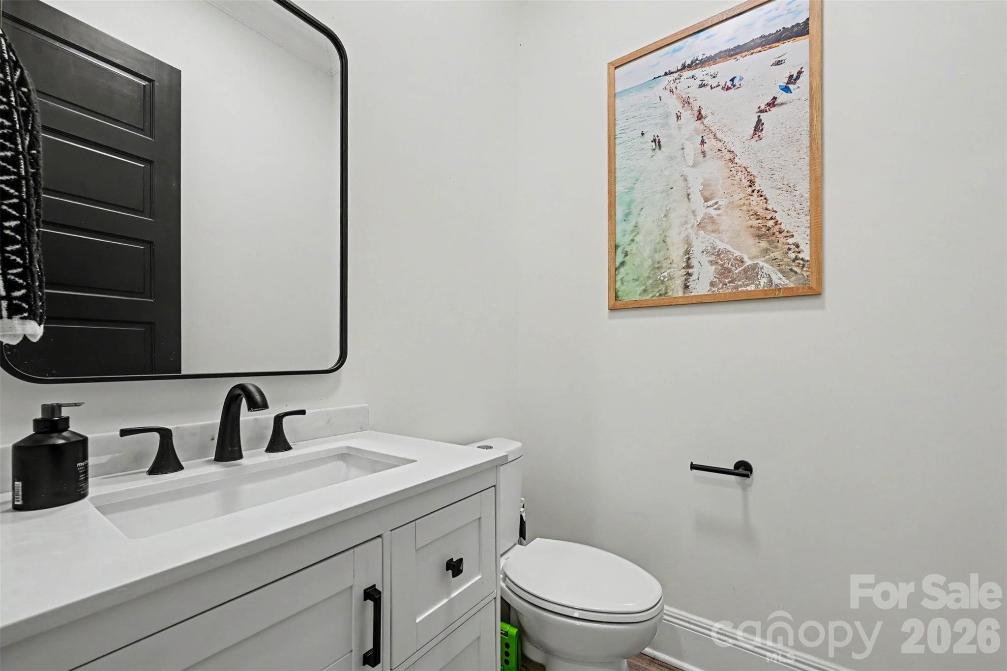 31 Ridgecrest Avenue Peachland, NC 28133 - Photo 30 of 30 a bathroom with a toilet sink and mirror