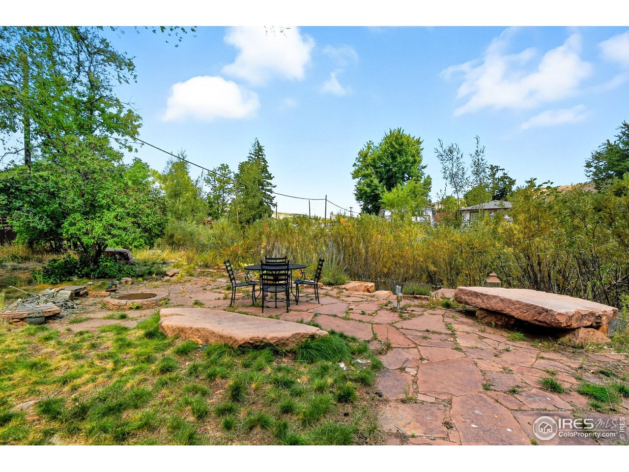 342 4th Avenue Lyons, CO 80540 - Photo 23 of 37 a view of a chairs and table on the terrace